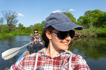 Man and woman couple, selfies are happy in family kayak trip rowing boat on the river, water hike,...