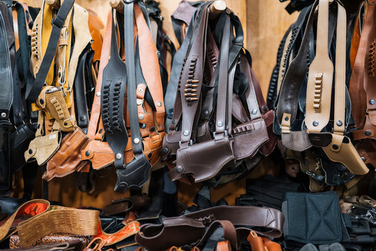 Leather holster belts in workshop