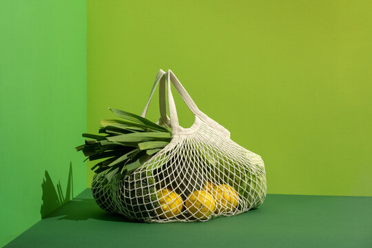 Reusable string bag with vegetables. Sustainable healthy shopping