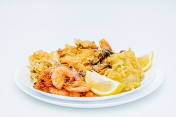 Seafood fried in oil on white plate. Prepared tutti frutti recipe.