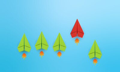 Leadership concept with red paper plane leading among green on blue background with copy space 