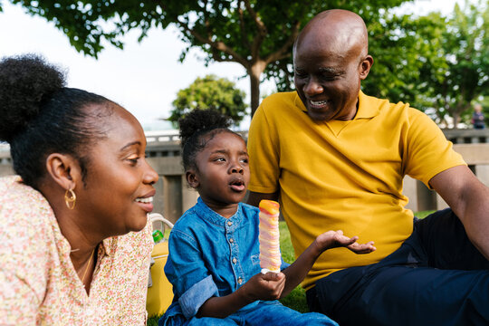 Delighted family chatting on summer weekend