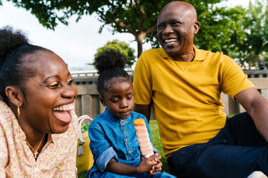 Cheerful family laughing on summer weekend
