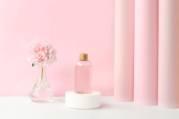 Spa and wellness composition with fragrant rose water and peony and rose flowers on elegant premium...