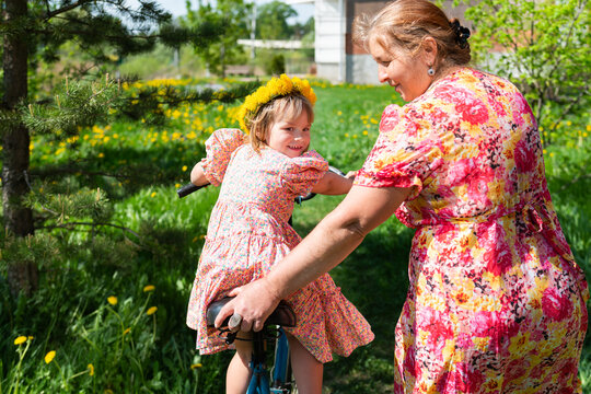 babysitter and child on on a bike ride