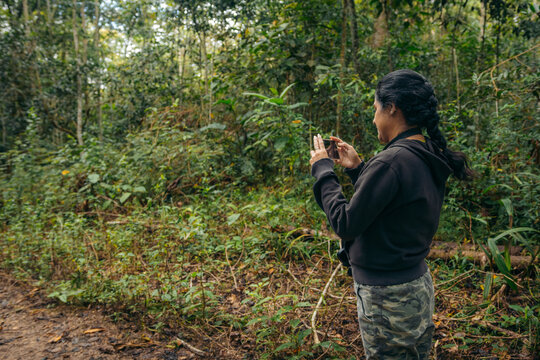 Woman taking photos in nature