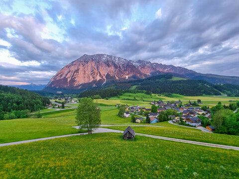 Summer austrian landscape with Grimming mountain (2.351 m), an isolated peak in the Dachstein Mountains, view from small alpine village Tauplitz, Styria, Austria