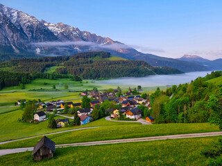 Summer austrian landscape with Grimming mountain (2.351 m), an isolated peak in the Dachstein Mountains, view from small alpine village Tauplitz, Styria, Austria