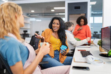 Happy casual people working in a creative coworking