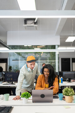 Young professionals collaborate in a modern office.