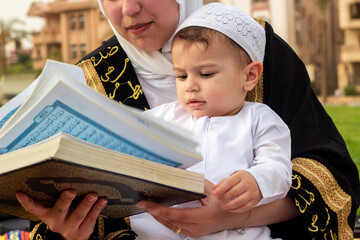 Mother Teaches Son to Read Quran on Eid