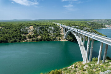 Fototapeta na wymiar Bridge's design seamlessly blends with surrounding nature, creating a harmonious visual experience.