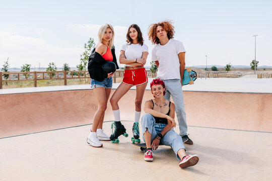 Portrait of group of cheerful teenagers looking and smiling at camera 