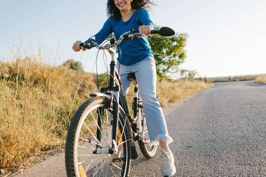 Woman Having Fun Riding A Bike