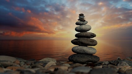 Balanced Rock Pyramid and Sunset on the Pebble Beach. Focus, Zen stones, Meditation, Spa, Harmony, Calmness, Balance Concept. The video of this image is in my portfolio.	