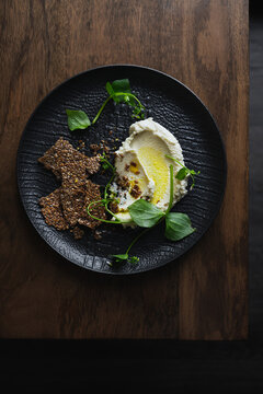 Healthy cream cheese made from almonds, served with flax seed crackers