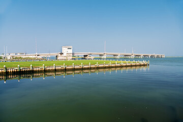 Road through the swamps to the Chincoteague bay nature reserve. Aerial view of the road and the reserve.