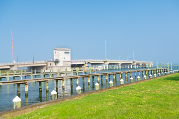 Road through the swamps to the Chincoteague bay nature reserve. Aerial view of the road and the reserve.