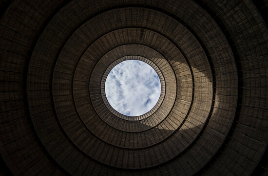 View from inside of top cooling tower hole of an abandoned power plant
