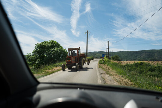 Fototapeta Car driving on Italian countryside roads