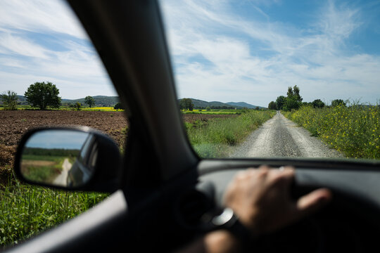 Car driving on Italian countryside roads