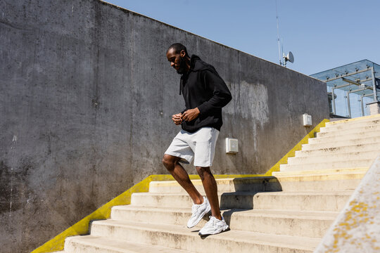 A man goes down the stairs outdoor