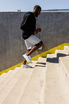 A man runs up stairs