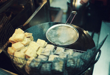 The chef is frying Stinky tofu
