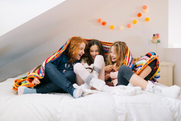 Girls tickling to each other