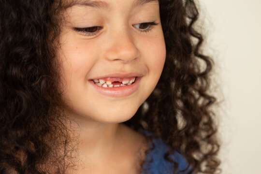 Closeup of a funny toothless little girl