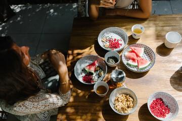 Women in the garden having a breakfast
