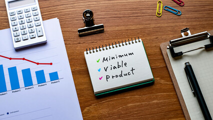 There is notebook with the word Minimum Viable Product. It is as an eye-catching image.