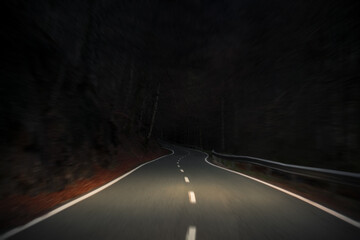 Fast night drive across scenic mountain road