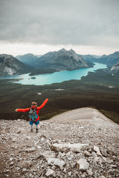 boy in red jacket having fun in the mountains