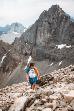 young boy hiking in rugged alpine area