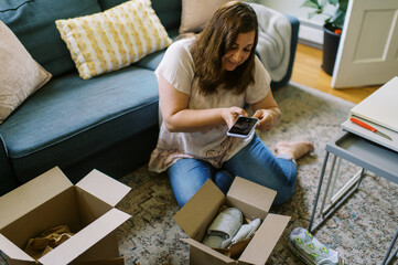online shopper unboxing her purchase at home