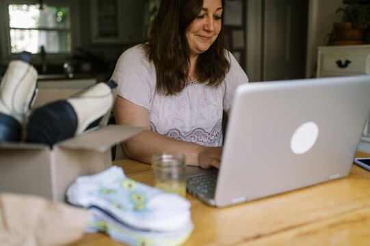 online shop owner working on her computer at home
