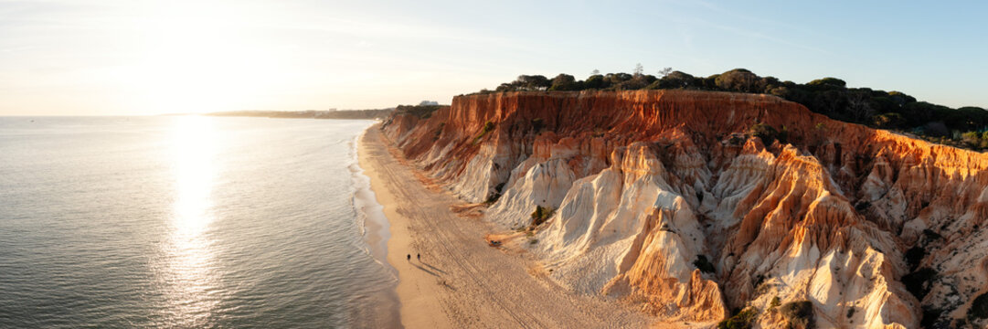 Praia da Fale&Igrave;sia beach cliffs aerial sunset Algarve Portugal