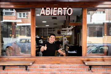 Portrait of a bar owner smiling.