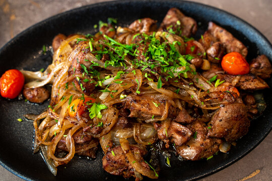 Chicken liver with onion dish. Traditional food