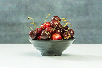 A small bunch of ripe cherries with stems