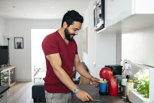 Man making coffee in the morning getting ready for the day