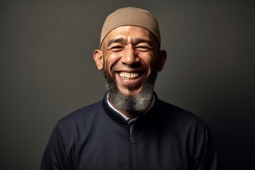Obraz premium Portrait of a happy Indian man with beard and mustache smiling.