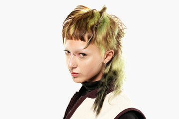 Multi-colored hair and creative make up and hairstyle. Trendy haircuts