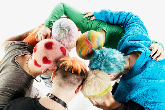 Group of people with colorful hair and costumes