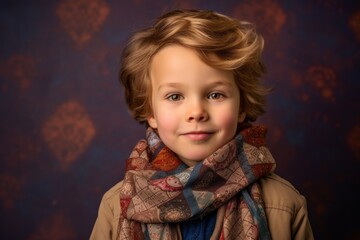 Portrait of a cute little boy in warm clothes. Studio shot.
