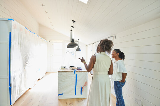 Black real estate agent showing a new house to client buyer