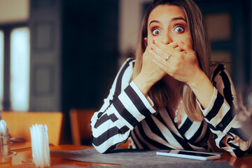 Secretive Woman Covering her Mouth . Shocked lady receiving a strange phone call
