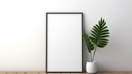 A picture frame and a plant on a wooden floor