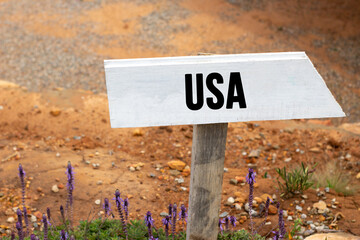 White wooden signpost with the word usa